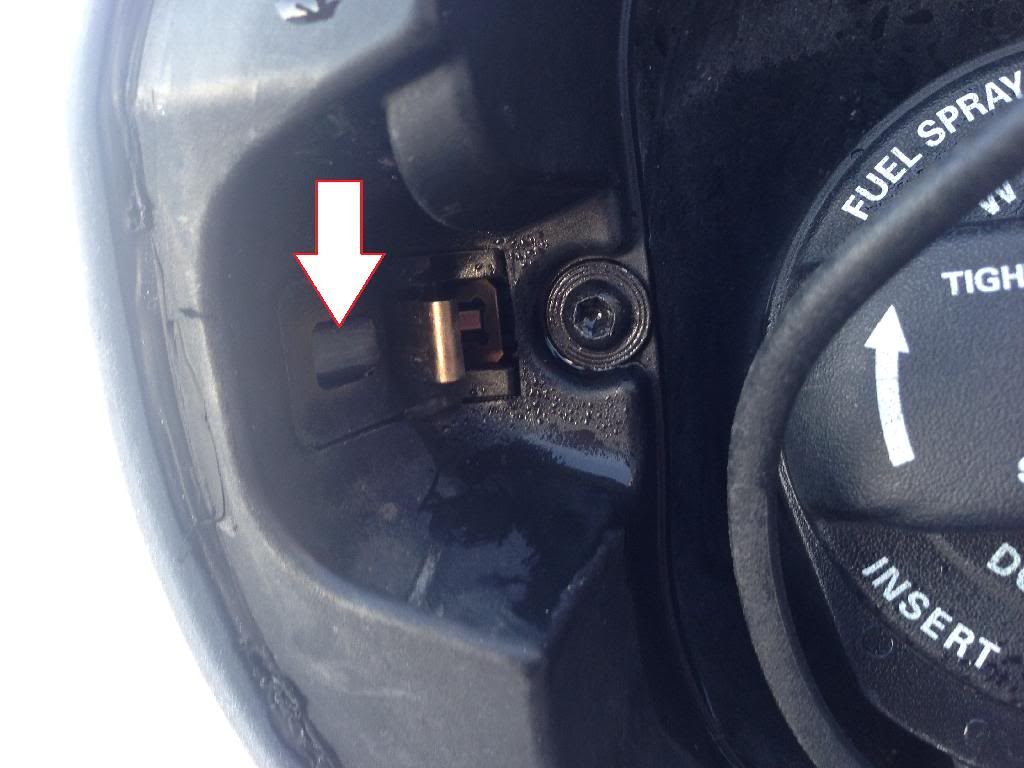 ... plastic piece in the eBay photo in my previous post. It's still inside the filler area. I touched it and it recessed a but but clearly the rod pulled ...
